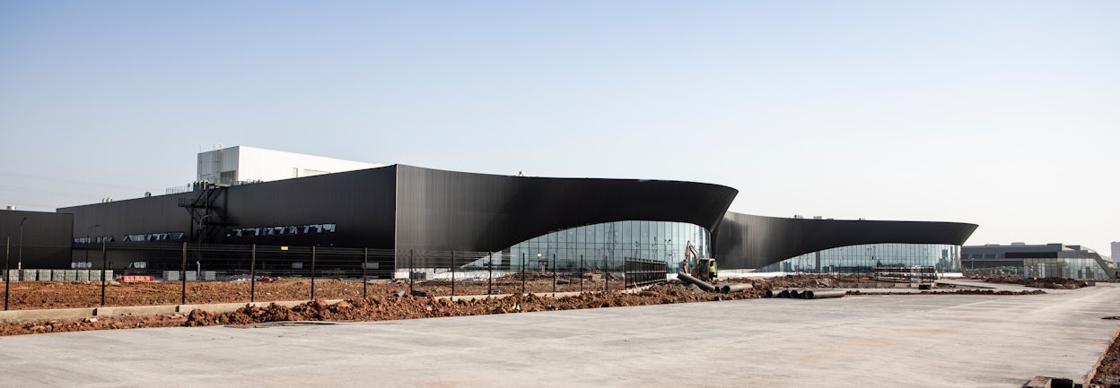 Black building with large glass windows.