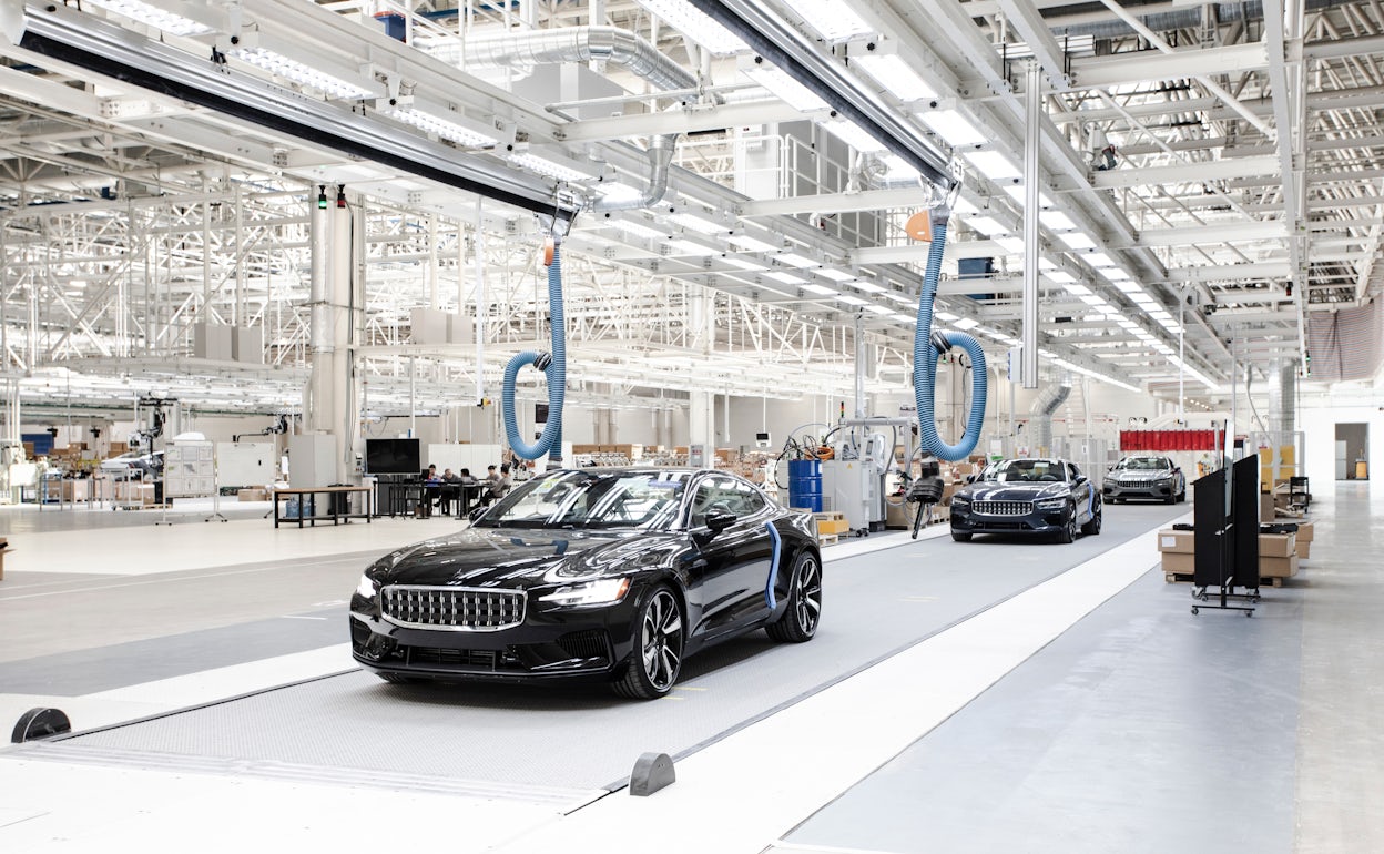 Line up of three pristine Polestar cars in the Polestar Production Centre in Chengdu, China.