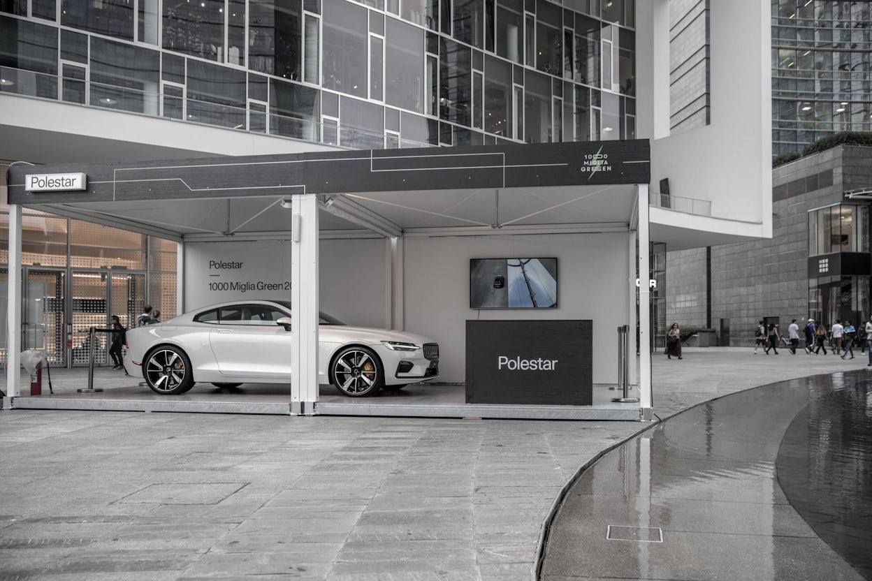 A white Polestar 1 displayed in a stand at the 1000 Miglia.