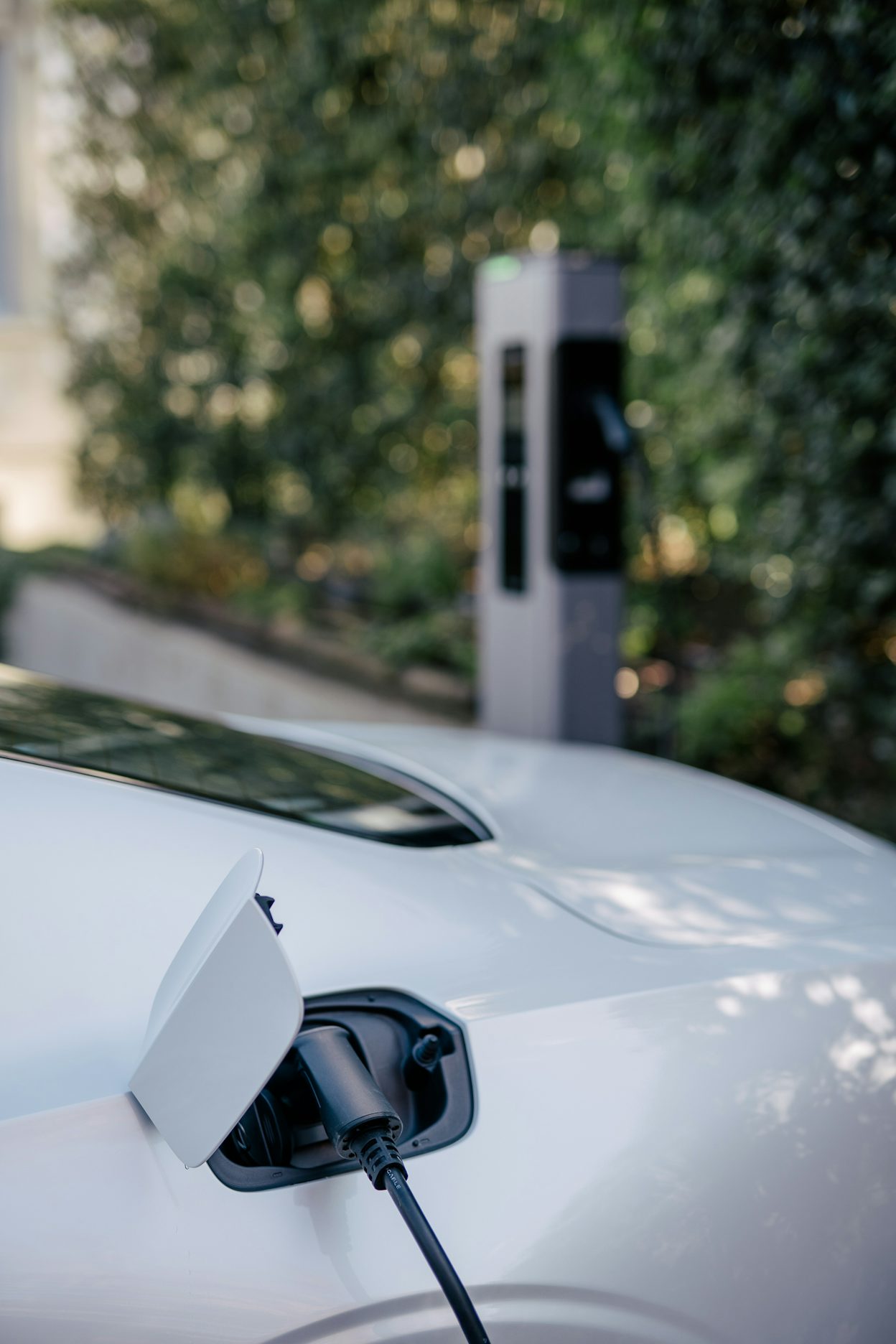 Close-up of a white Polestar 1 being charged.