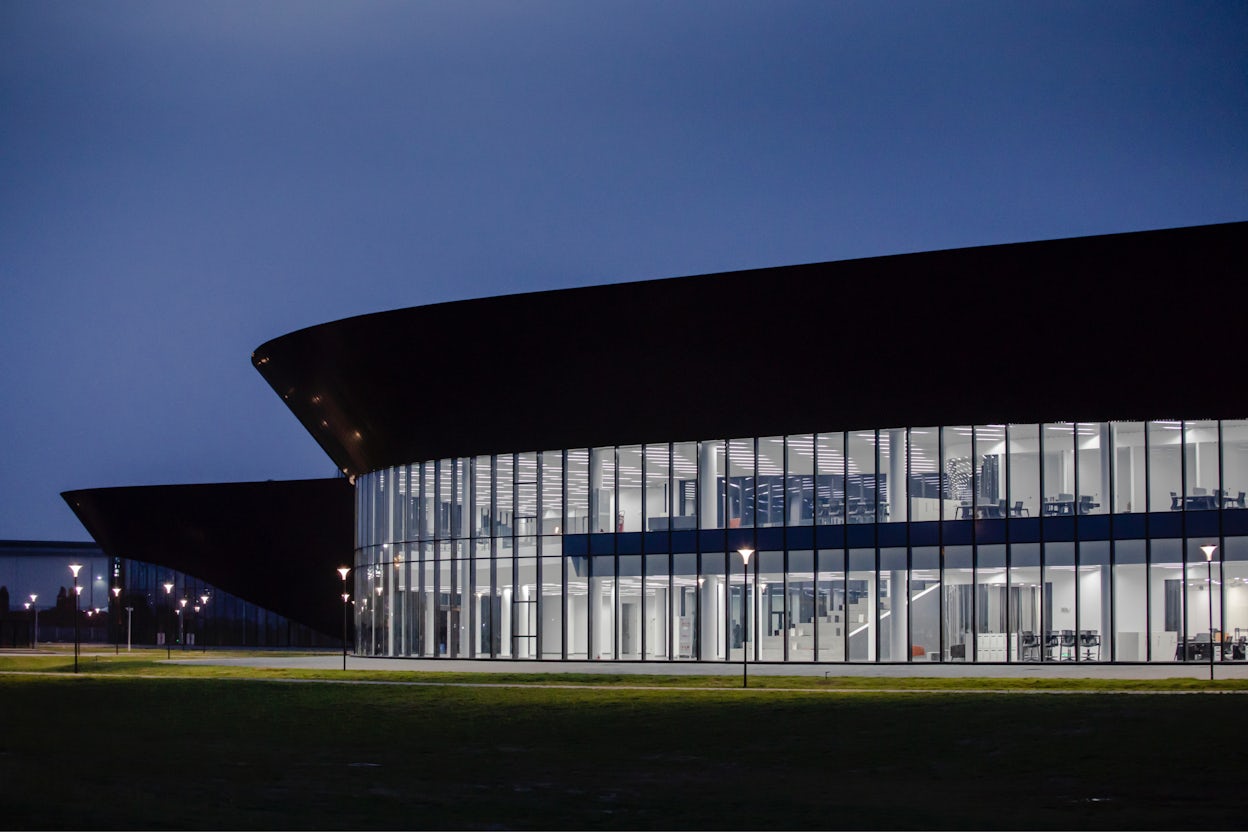 Windows at The Polestar Production Centre in Chengdu, at night time.