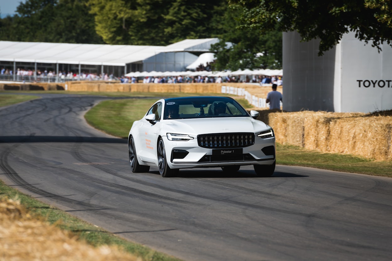 Front view of a white Polestar 1 on the racing track at the Goodwood Festival of Speed.