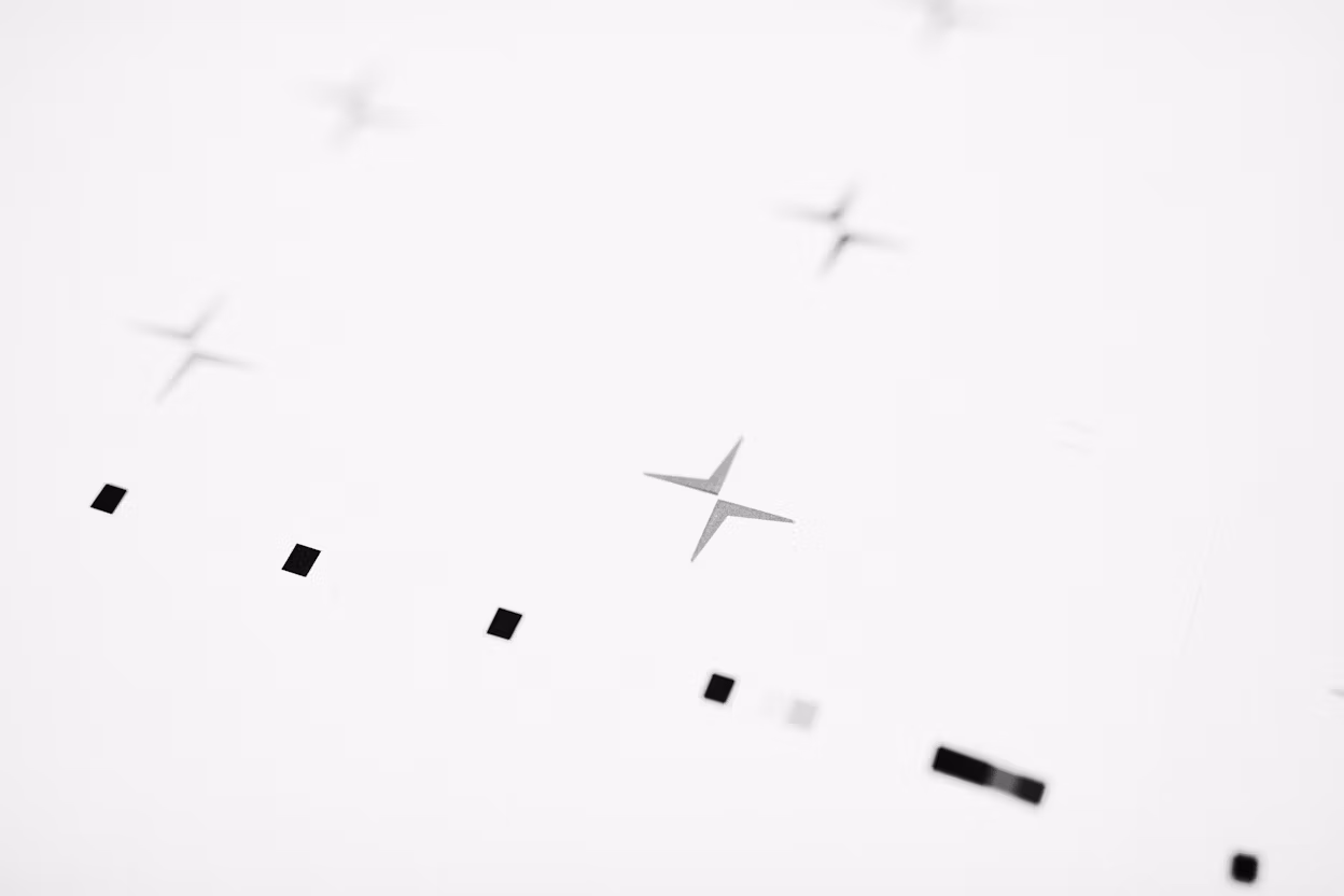 Black dots and the Polestar logo on a white background