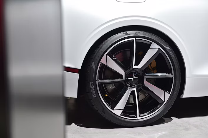 A close-up of a pristine wheel on a white Polestar.
