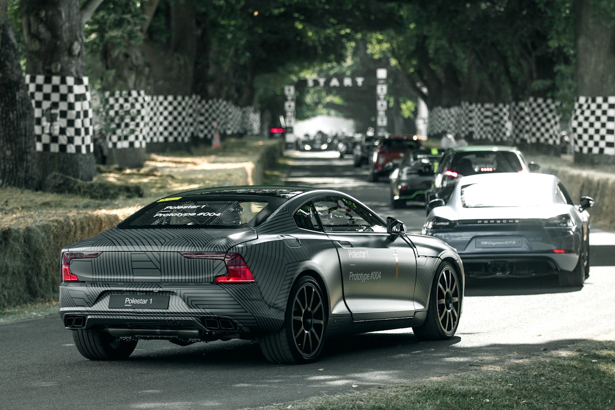 Back view of a grey Polestar 1 with the license plate saying Prototype #004.