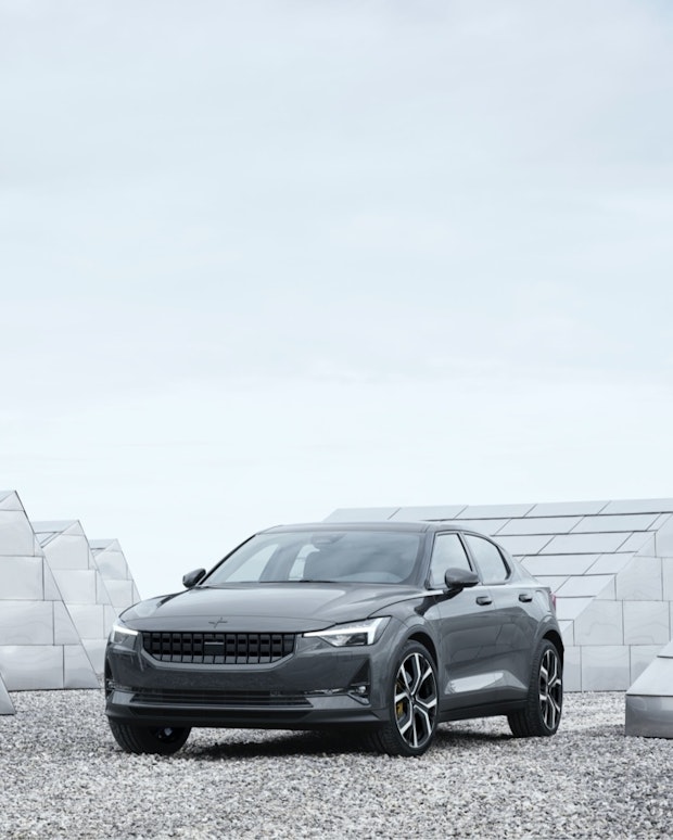 Dark grey Polestar 2 standing around mirror-objects