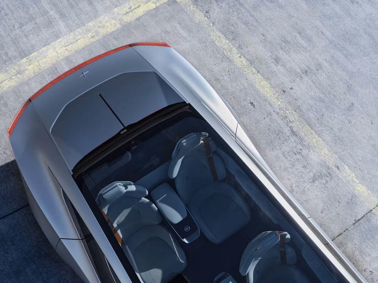 Bird's-eye view of the Polestar Precept parked on concrete lot.