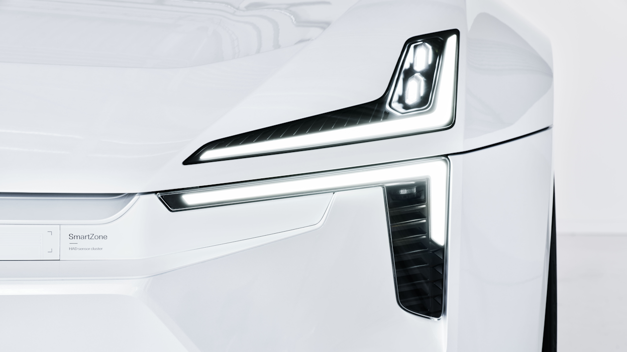 The left side headlights of a white Polestar Precept.