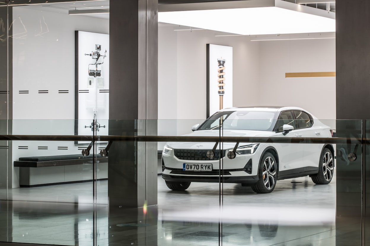 A white Polestar 1 on display in a Polestar space.