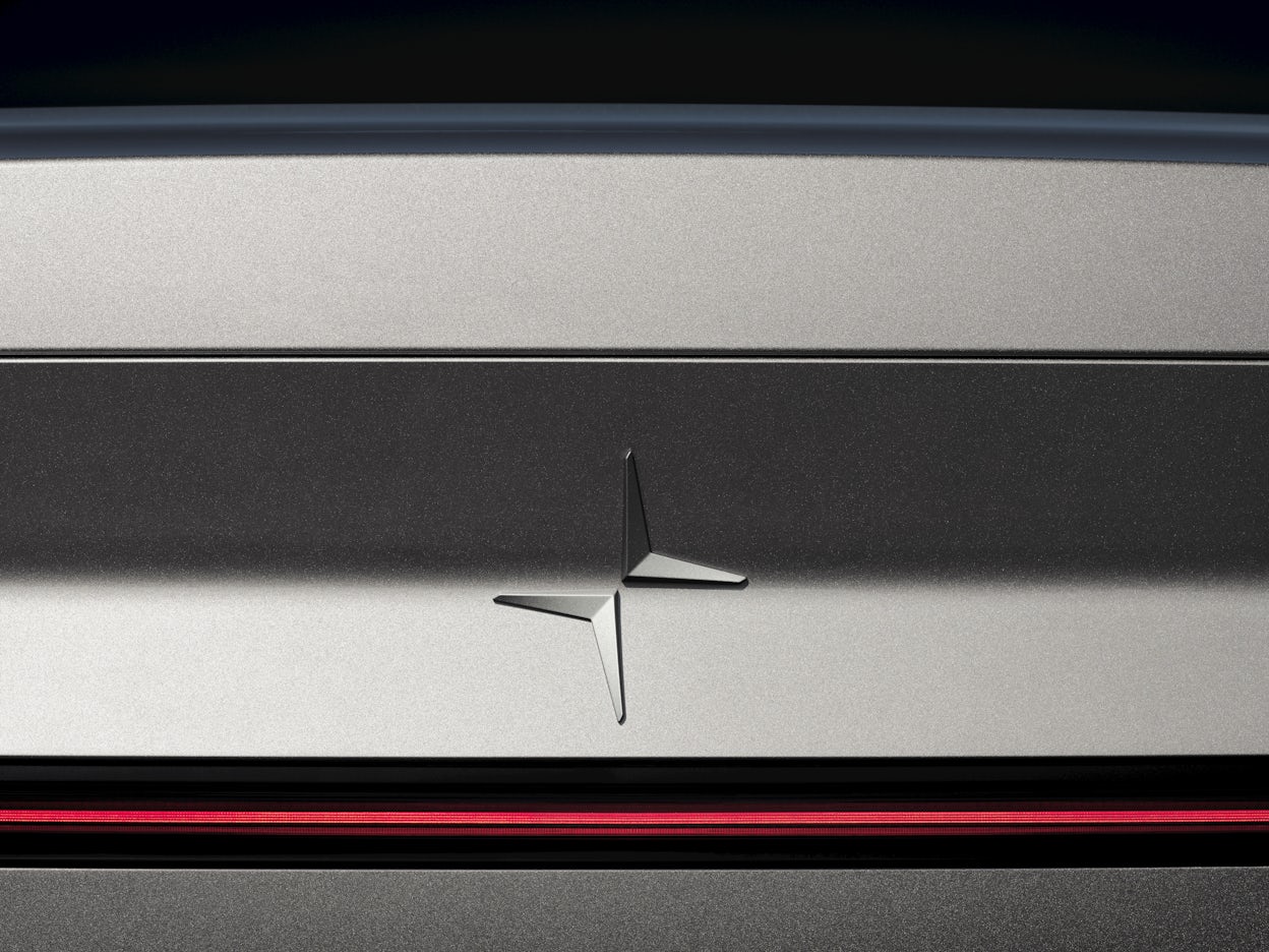 The Polestar logo on the exterior of a Polestar 2.