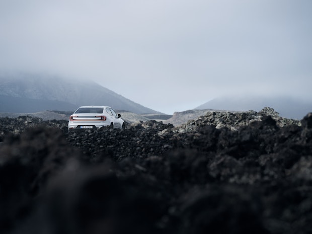 Backside of Polestar 2 in a mountain landscape