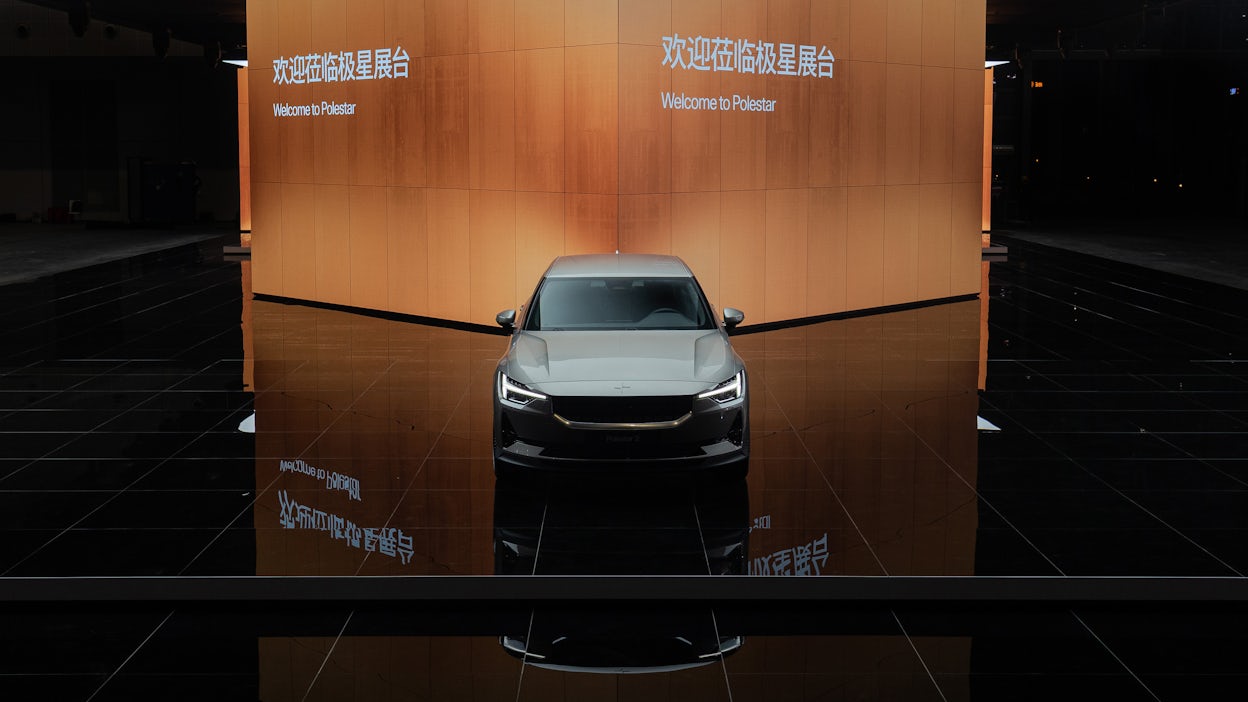 Front view of a grey Polestar 2 displayed at the Auto Shanghai show 2021.
