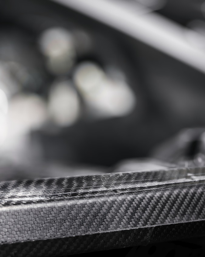 Detailed view over the Carbon fibre that covers a large part of the upper body of Polestar 1 