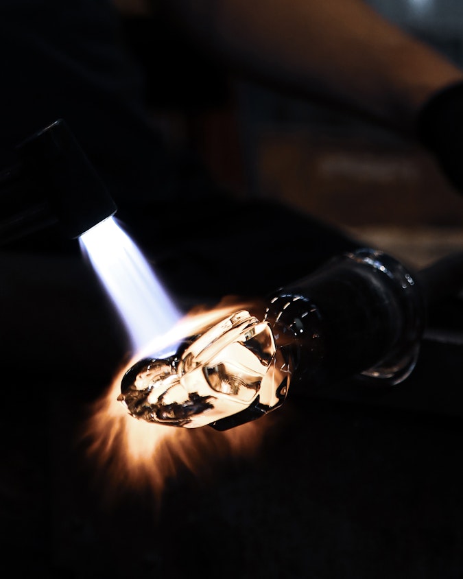 Glass artisans making gearshift out of lead-free crystal.