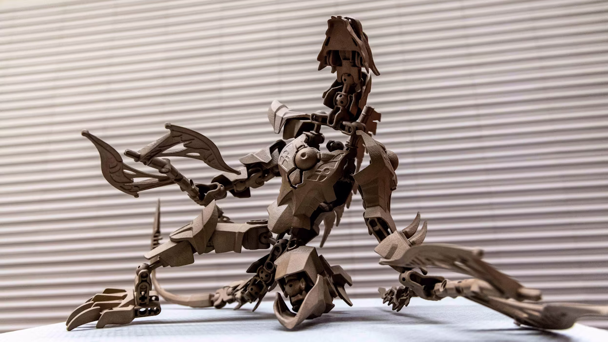 Art piece Brain Activity resembling a robot made out of beige plastic.