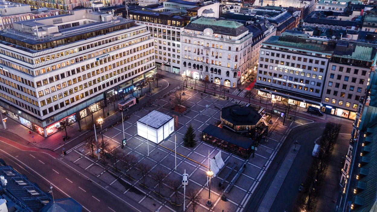 Aerial view of Norrmalmstorg with the luminous Polestar cube on the square.