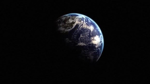 Earth partially illuminated in space, showing clouds, oceans, and landmasses on a dark background.