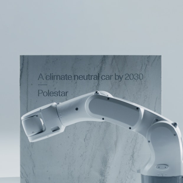 AI-robot engraves marble stone with text saying A climate neutral car by 2030