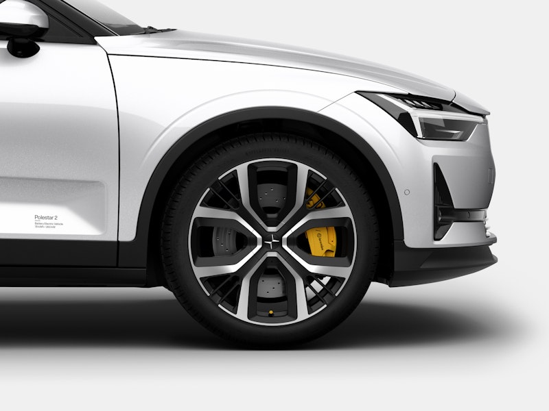 Side of a white Polestar 2 showing the wheel and rims