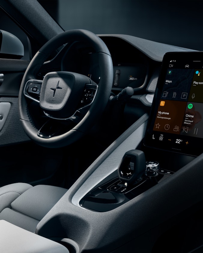 Detailed view over the driver´s seat, wheel and in-car display in Polestar 2