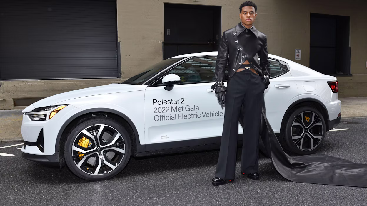 Jeremy Pope in front of a Polestar 2.