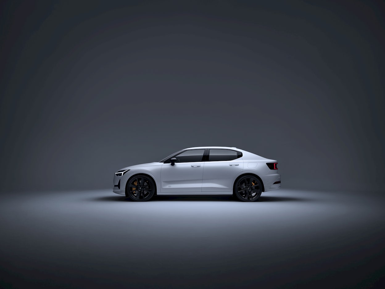 A white Polestar 2 in a studio. 