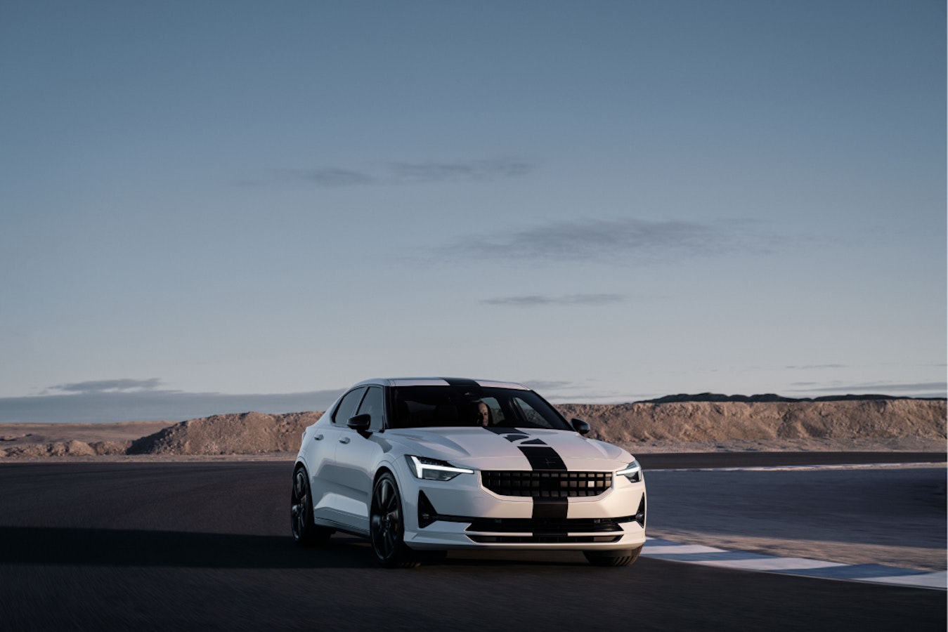 3/4 side and front view of race stripe adorned Polestar 2 BST edition 270.