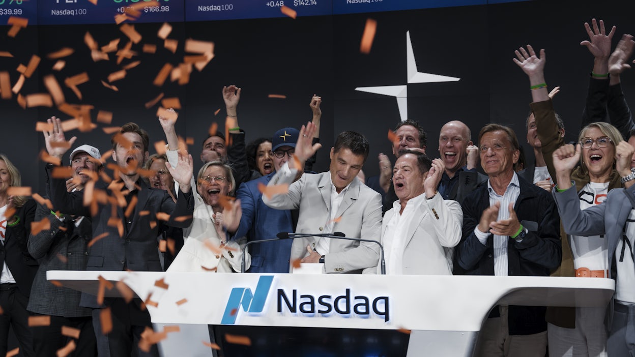 Thomas Ingenlath together with cheering people at bell-ringing ceremony at Nasdaq NY.