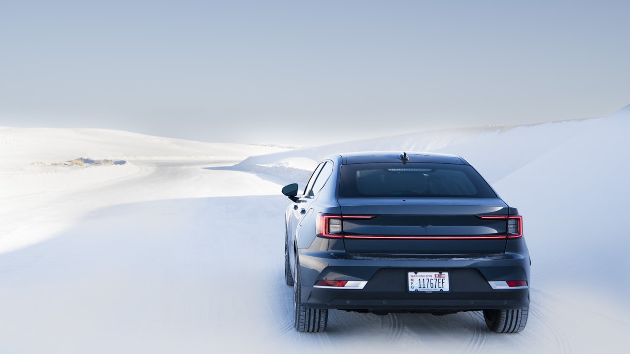 Polestar 2 in snow covered landscape.