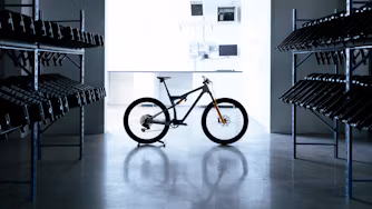 A backlit mountainbike in warehouse.