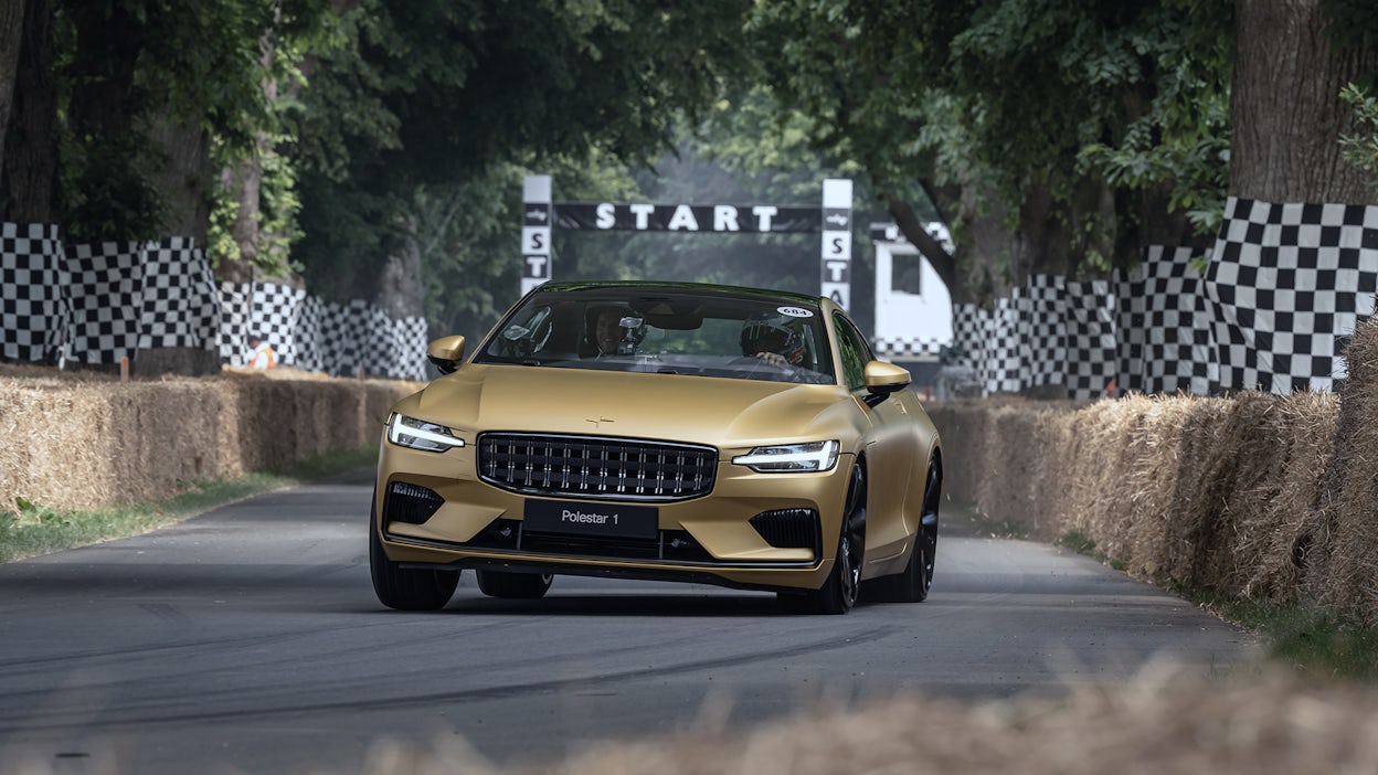 Sun Gold Polestar 1 racing at Goodwood hillclimb.