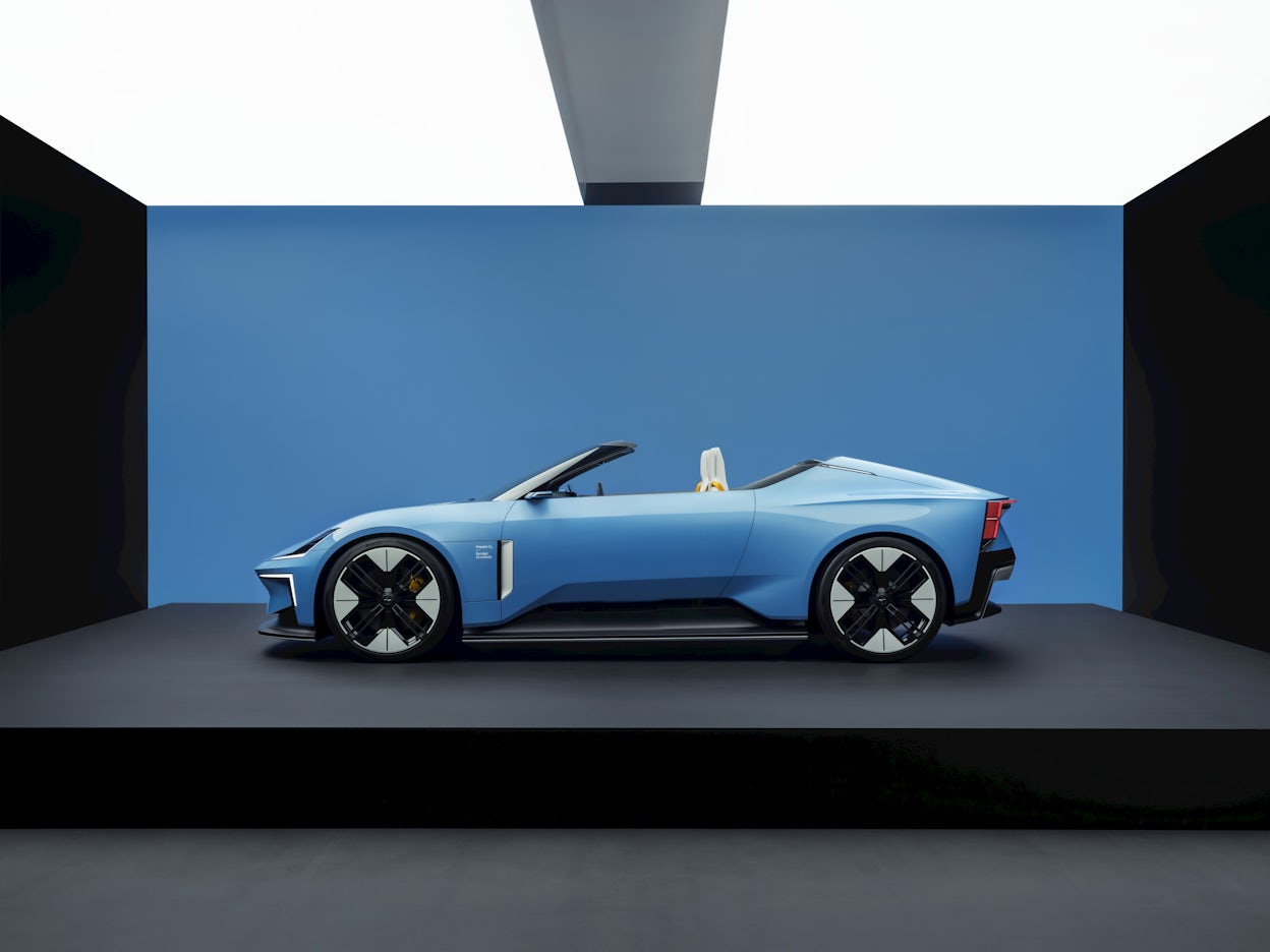 A blue Polestar O₂ convertible, side view.