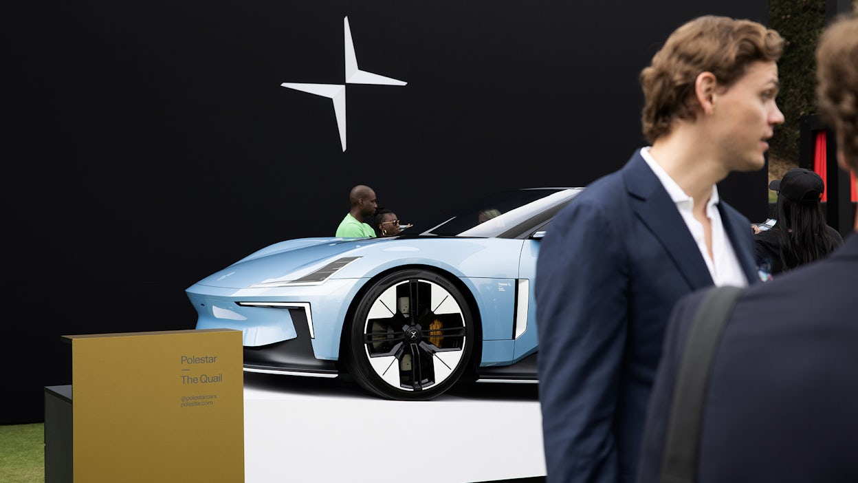 People gathered around the light blue Polestar 6 LA Concept edition.