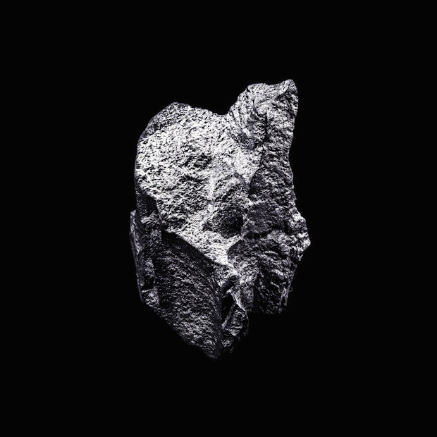 Silvershimmering rock, black background