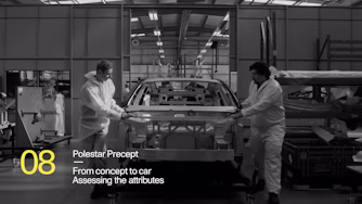 A Polestar car being assembled at a production facility.
