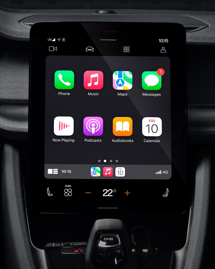 Tablet in the middle of the dashboard showing Apple CarPlay