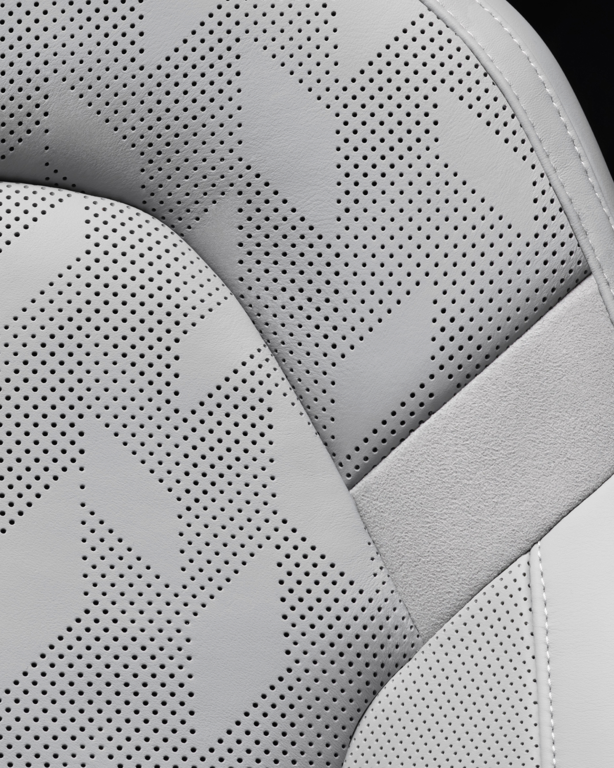 close-up on the light Nappa leather seat and yellow belts.