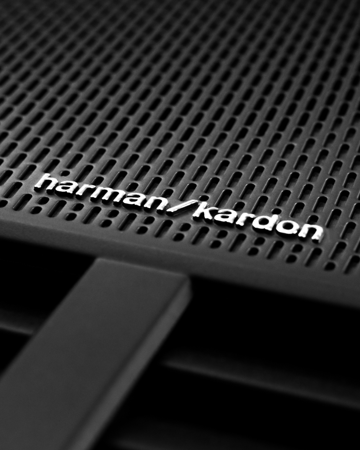 Close-up on the black speakers from Harman/Kardon