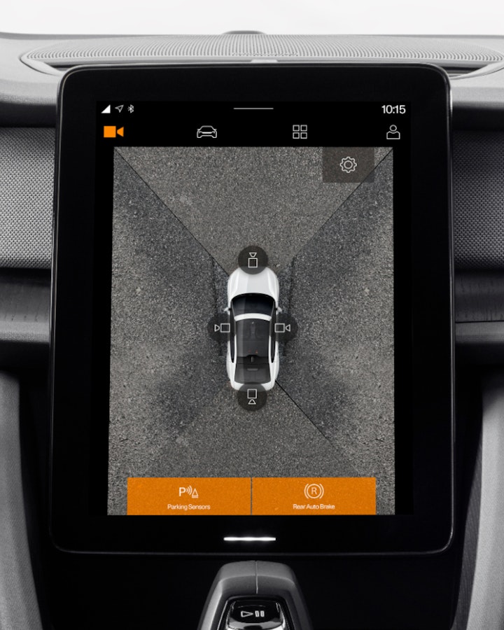 Tablet in the middle of the dashboard showing how the parking sensors and assistance works
