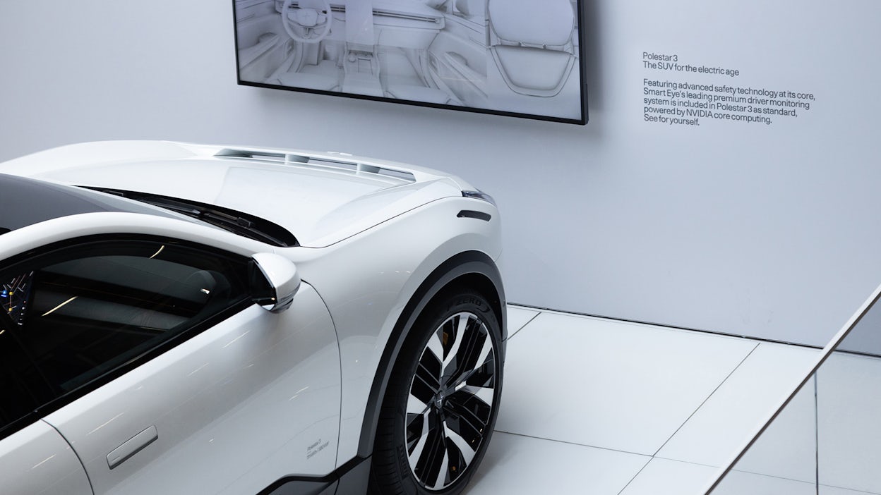 A white Polestar 3 displayed in a minimalistic space at the CES event.