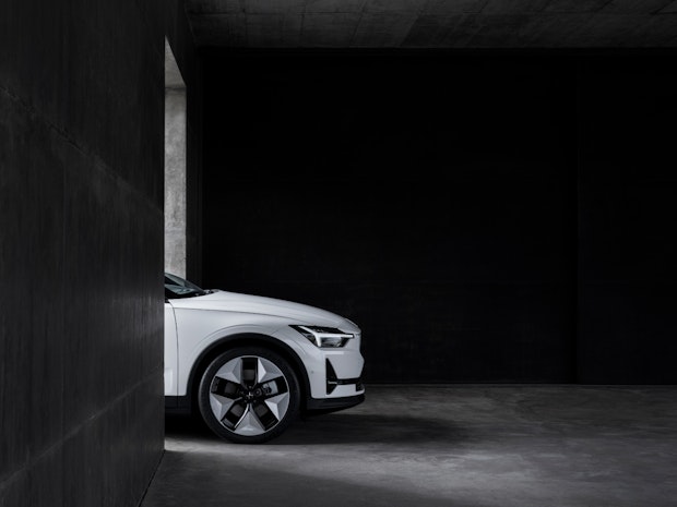 Polestar 2 front side view in dark concrete environment