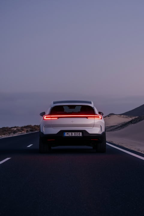polestar 3 shown from behind driving on the road