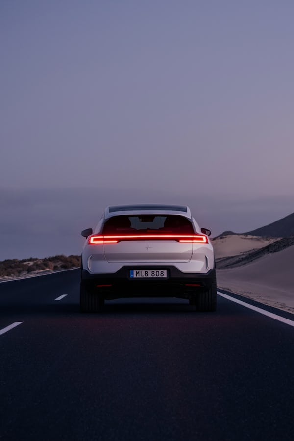 polestar 3 shown from behind driving on the road