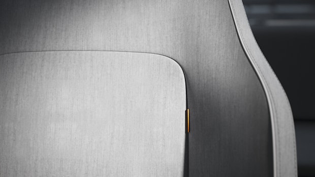 Grey seat with golden label