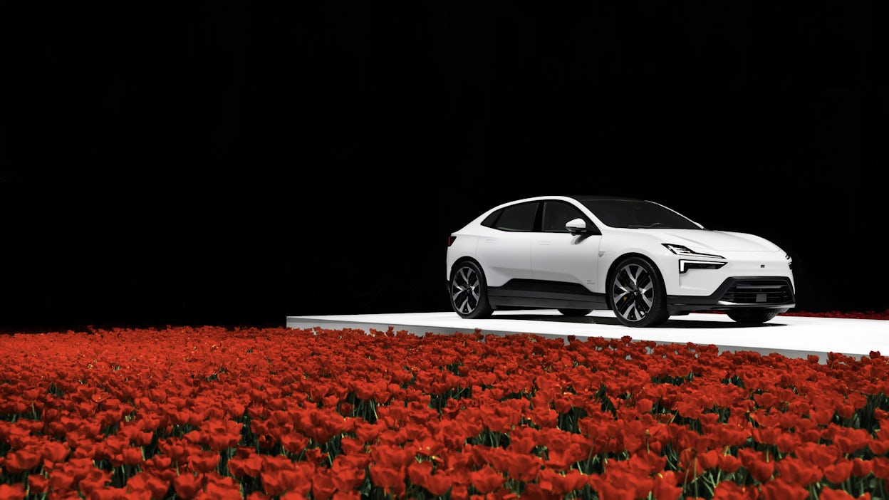 Polestar 4 in a field of flowers.