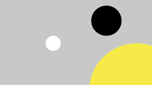 Grey background with one white, one black and one yellow circle.