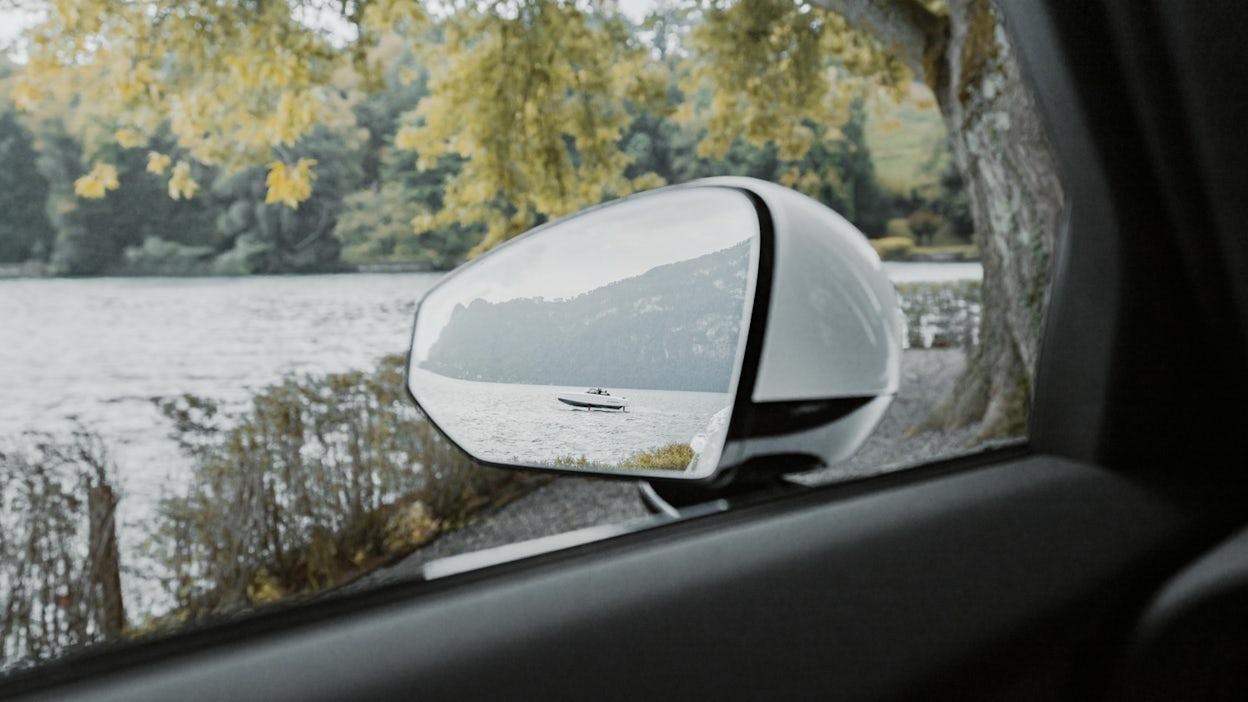 Boat reflection in car mirror