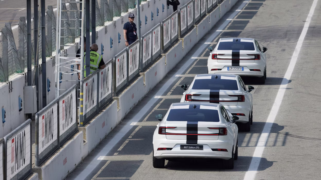Three Polestar 2 BST edition 230 driving out of the pit lane