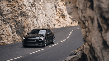 Polestar 2 driving through the mountains