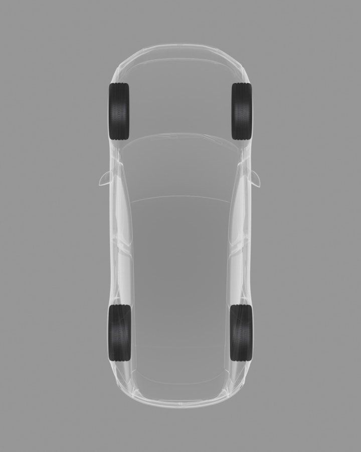 Top-down view of the car on a grey background showing a graphical, x-ray of the staggered stance of the wheels.